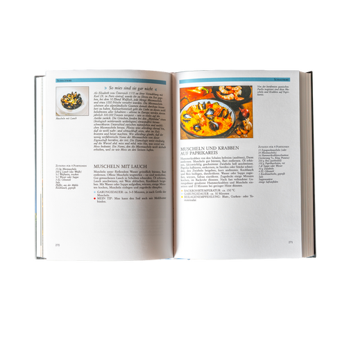 Open cookbook with two recipes for seafood and photos of the finished dishes on a white background.